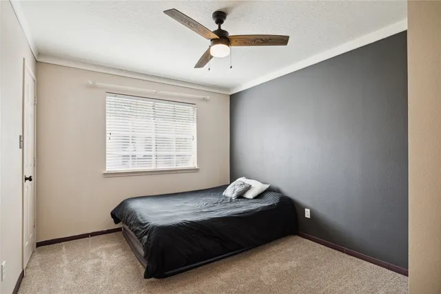 a bedroom with a bed and window