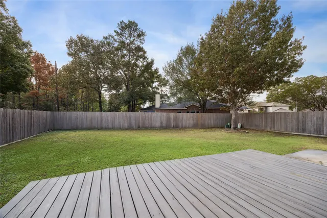 a view of a backyard with wooden floor