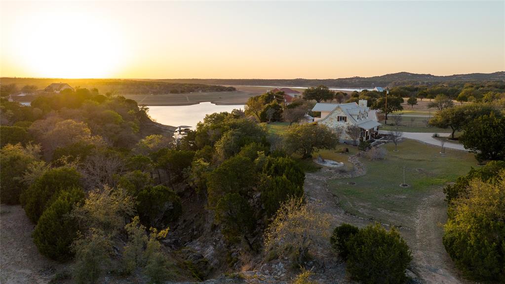 5255 Lookout Ridge Drive Marble Falls, TX 78654 - Photo 28 of 40 Sunset aerial, home, canyon, Lake Travis, front yard or pasture