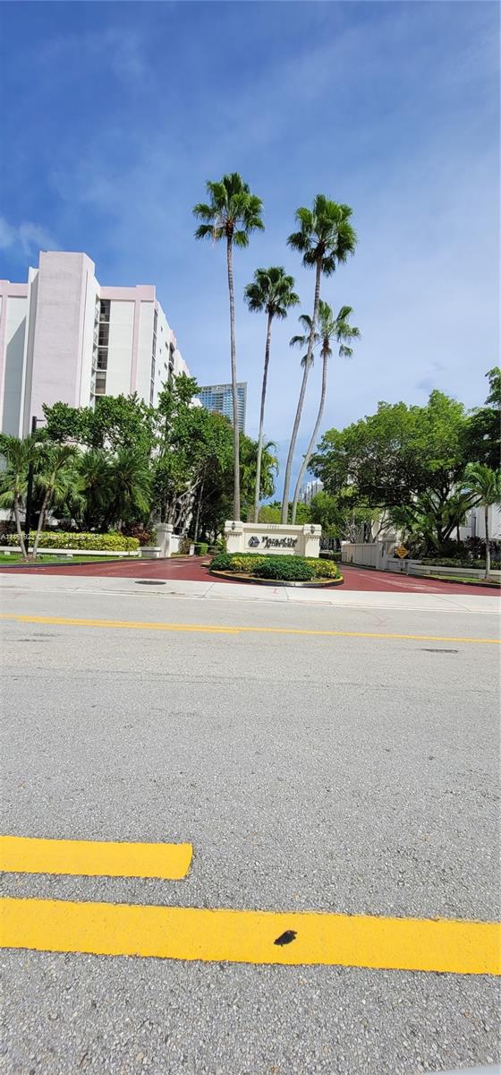 17021 North Bay Road, Unit 516 Sunny Isles Beach, FL 33160 - Photo 2 of 10 a view of a swimming pool and a yard