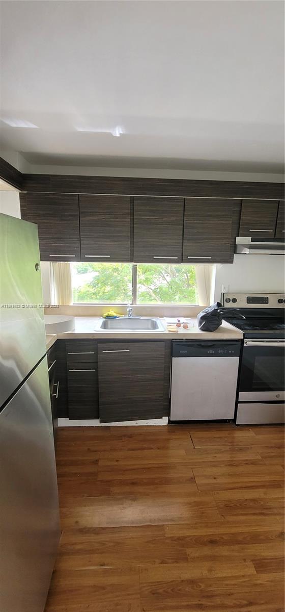 17021 North Bay Road, Unit 516 Sunny Isles Beach, FL 33160 - Photo 10 of 10 a kitchen with stainless steel appliances a stove and a window
