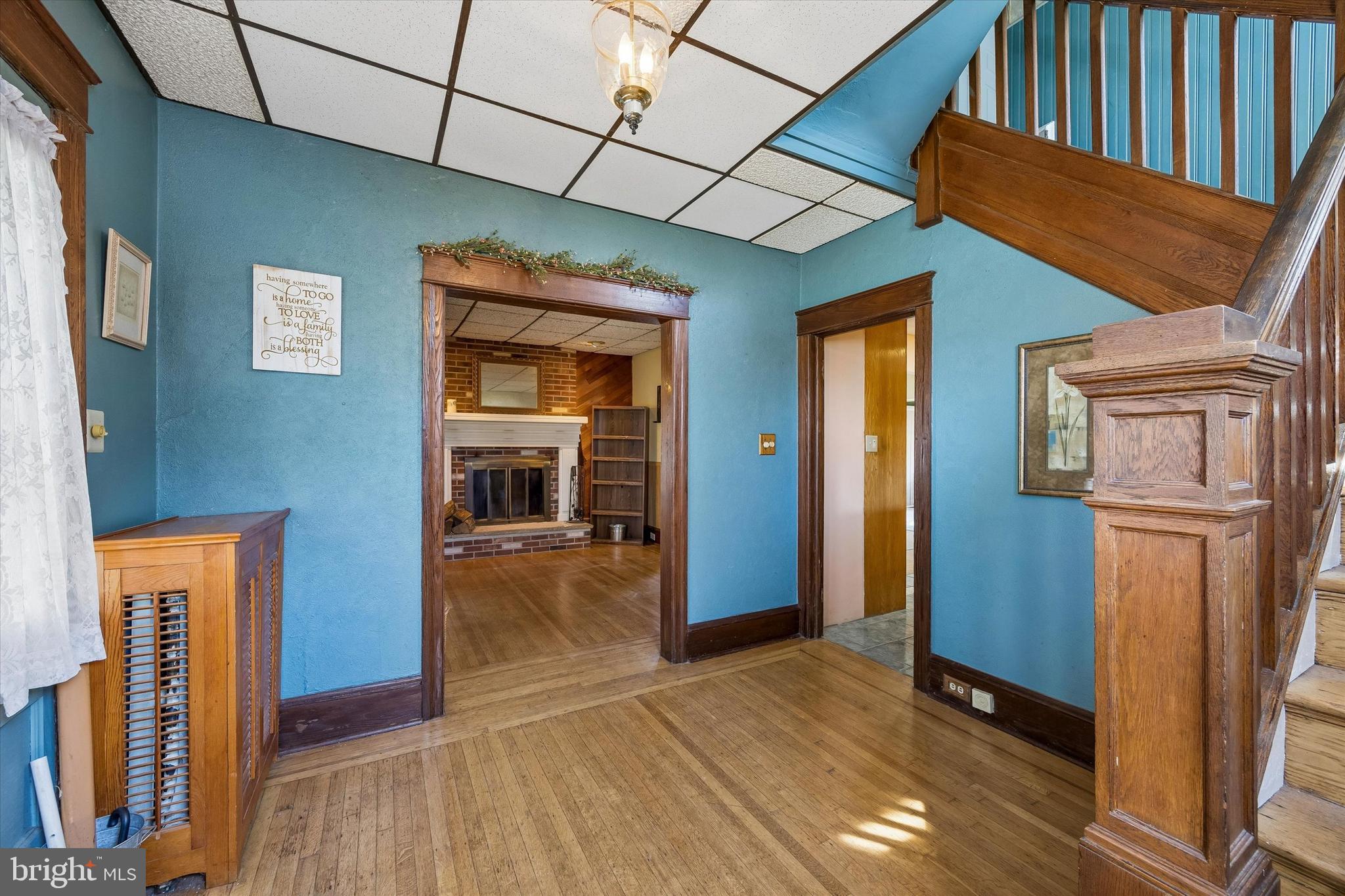 620 Gilbert Road Ridley Park, PA 19078 - Photo 3 of 35 a view of a hallway with wooden floor and staircase