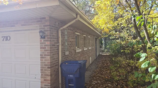 a backyard of a house with large trees