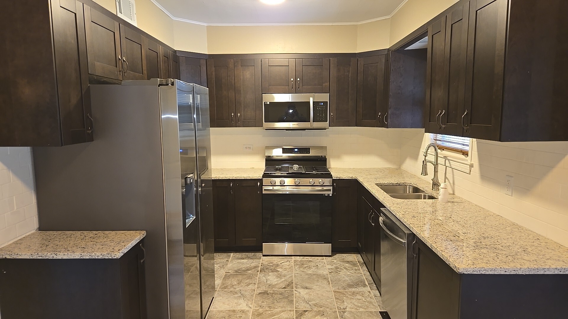 710 Bruce Avenue Flossmoor, IL 60422 - Photo 9 of 20 a kitchen with granite countertop a refrigerator stove and sink