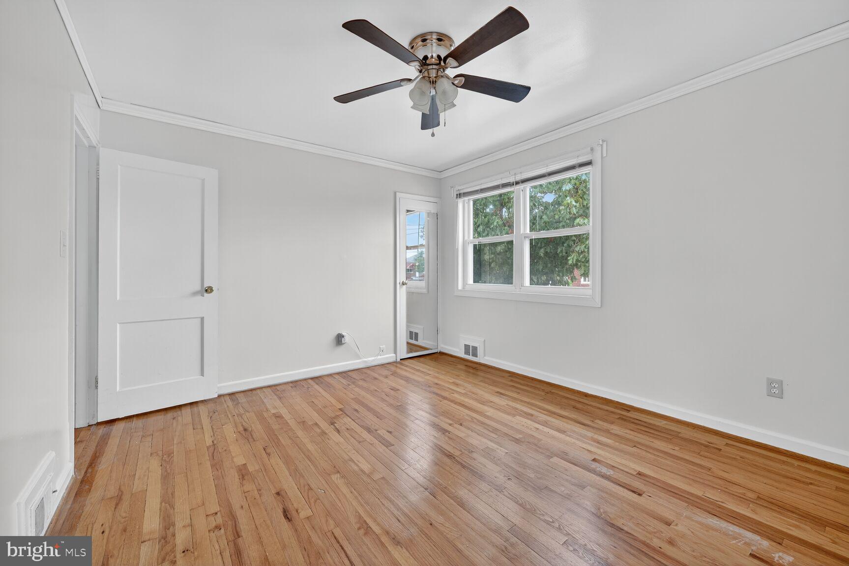 5720 5th Street Northeast Washington, DC 20011 - Photo 12 of 24 wooden floor in an empty room with a window