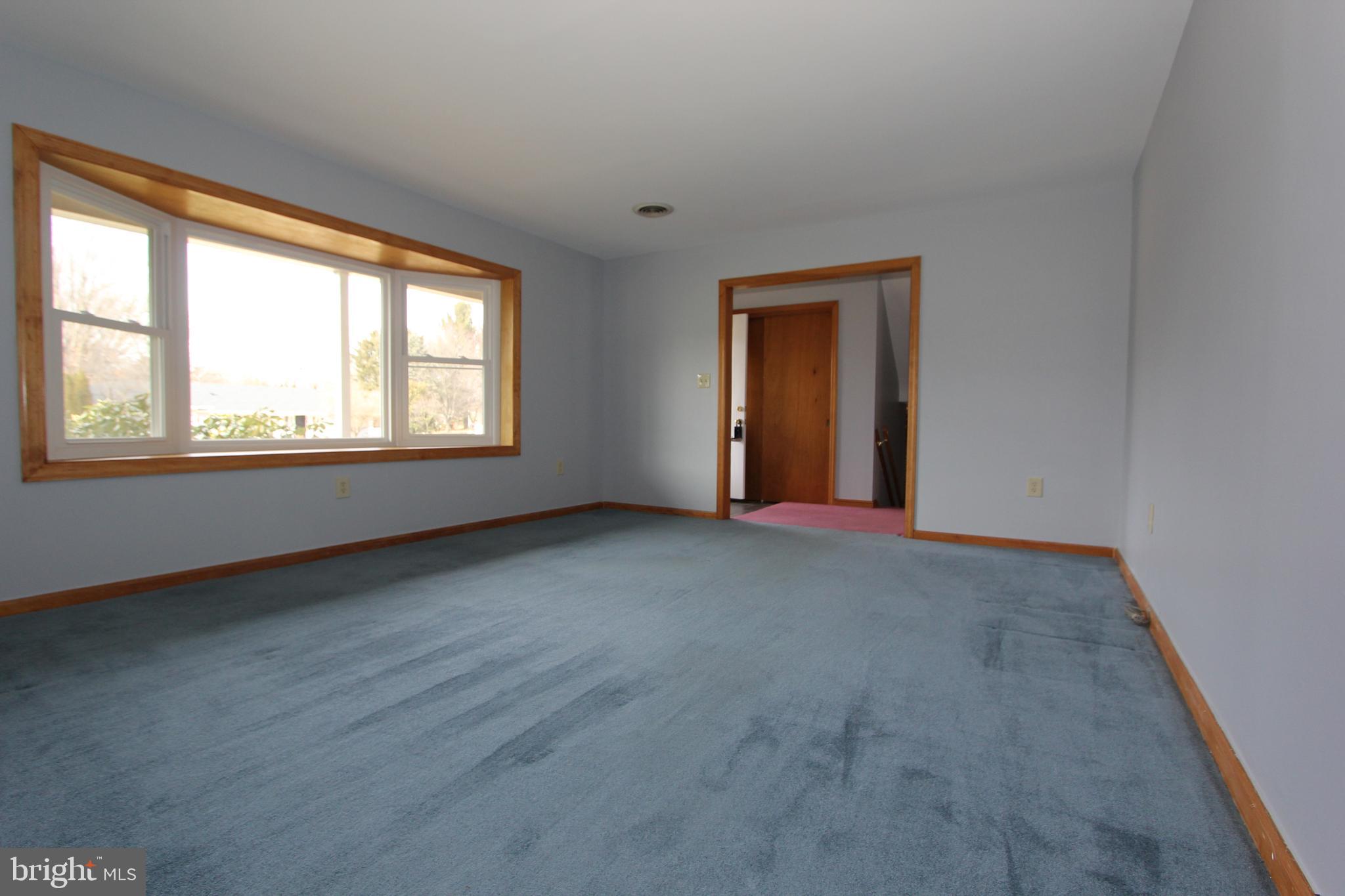 8001 Clearfield Road Frederick, MD 21702 - Photo 15 of 55 Huge living room with hardwoods under the carpet