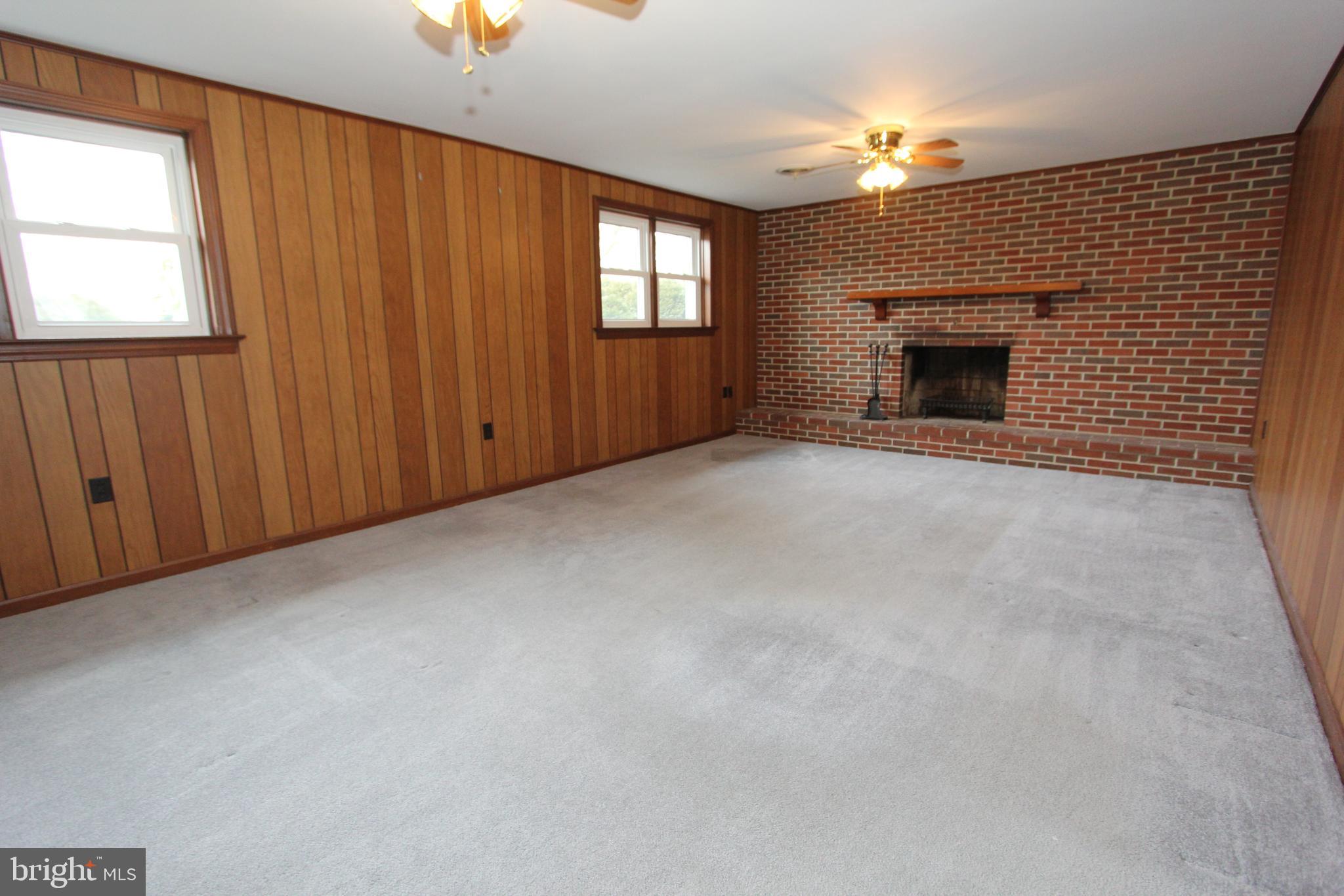 8001 Clearfield Road Frederick, MD 21702 - Photo 18 of 55 Family room with wood-burning fireplace