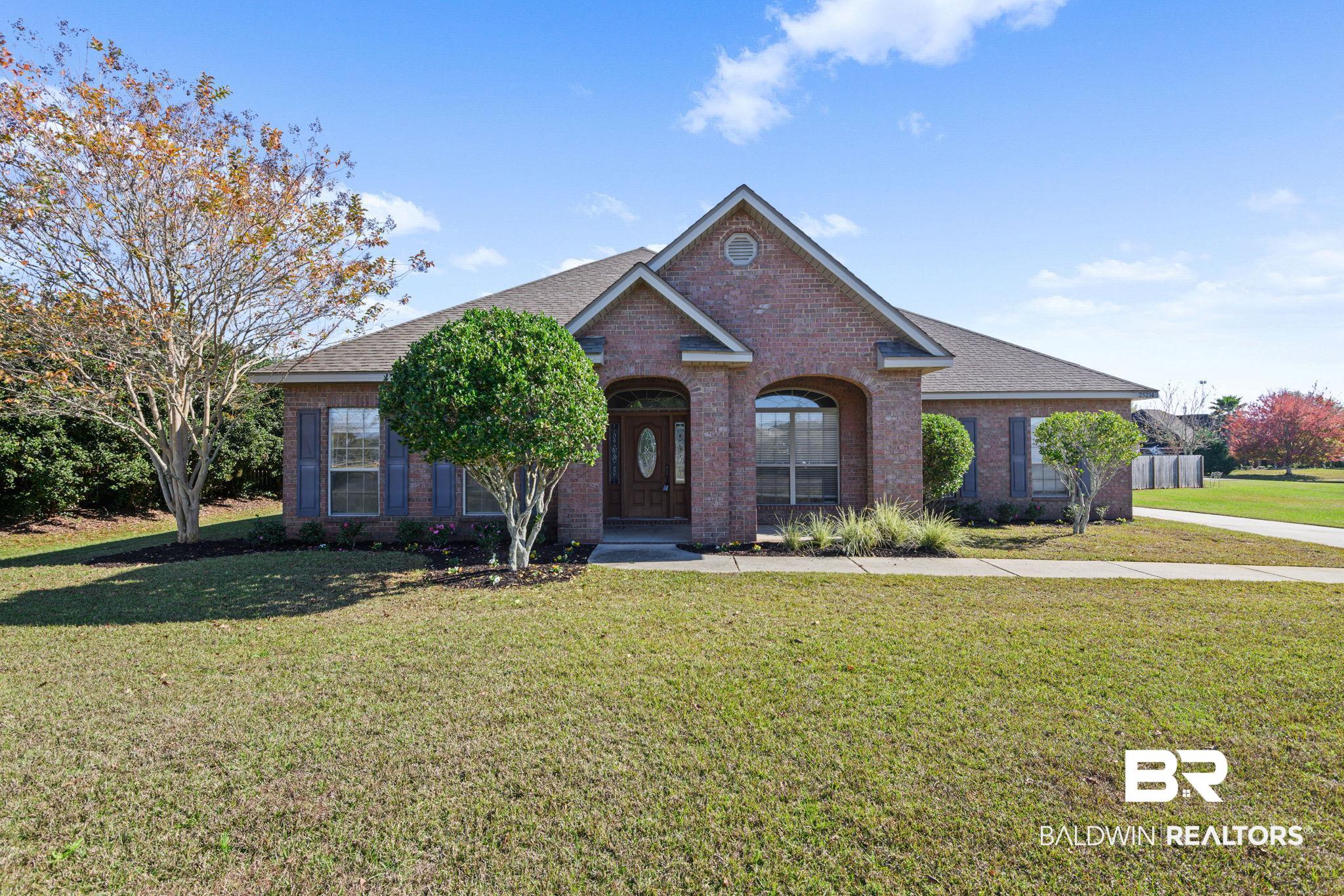 25234 Fairfax Road Daphne, AL 36526 - Photo 2 of 45 View of front of property featuring a front lawn, brick siding, and a shingled roof