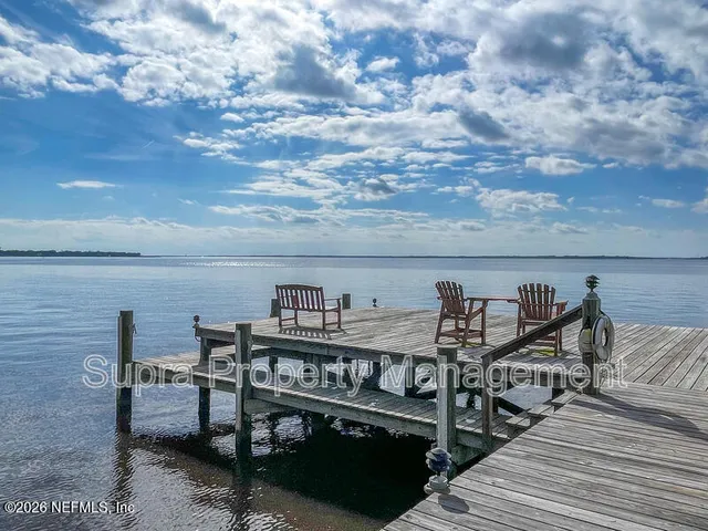 a view of swimming pool with outdoor seating and yard