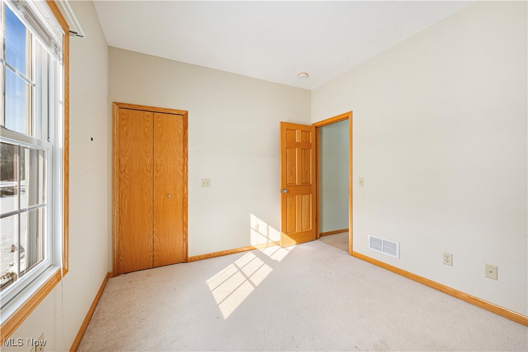 706 Watson Road Deerfield, OH 44411 - Photo 22 of 36 Unfurnished bedroom with light carpet