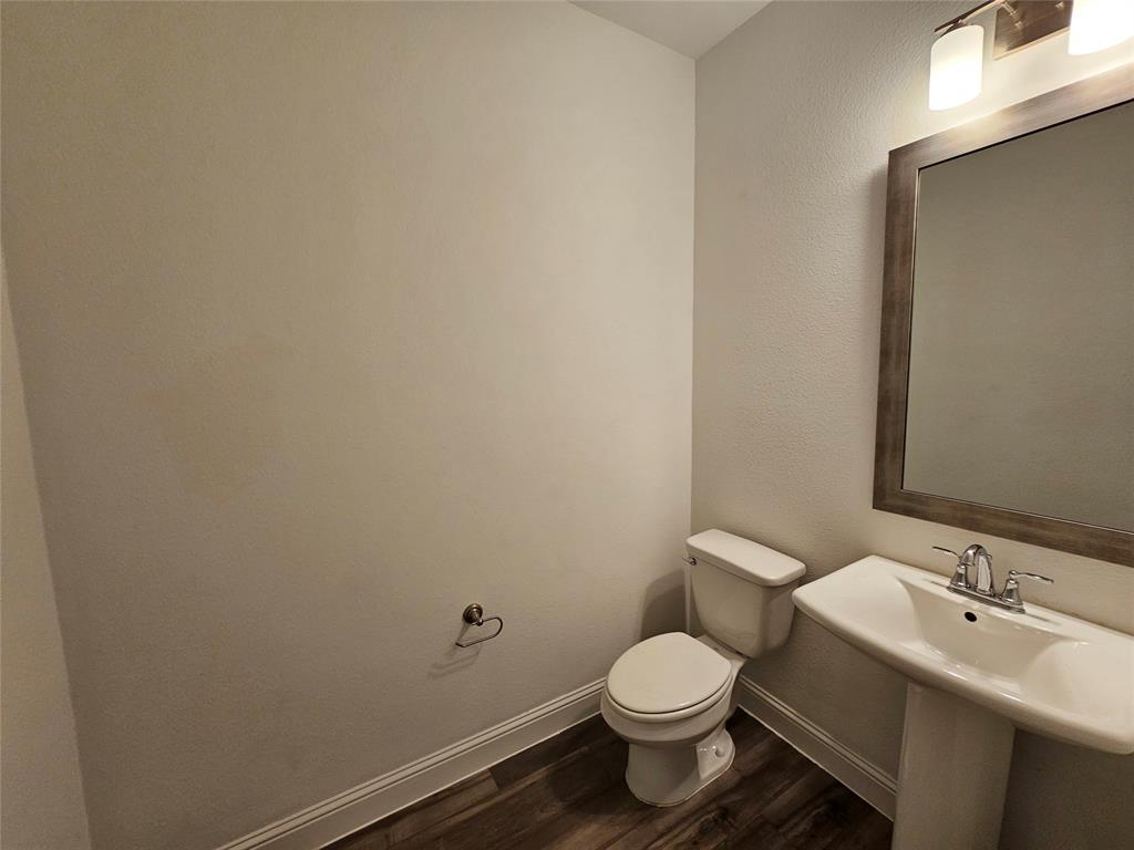 7280 Panicum Drive Frisco, TX 75033 - Photo 12 of 36 a bathroom with a sink and toilet