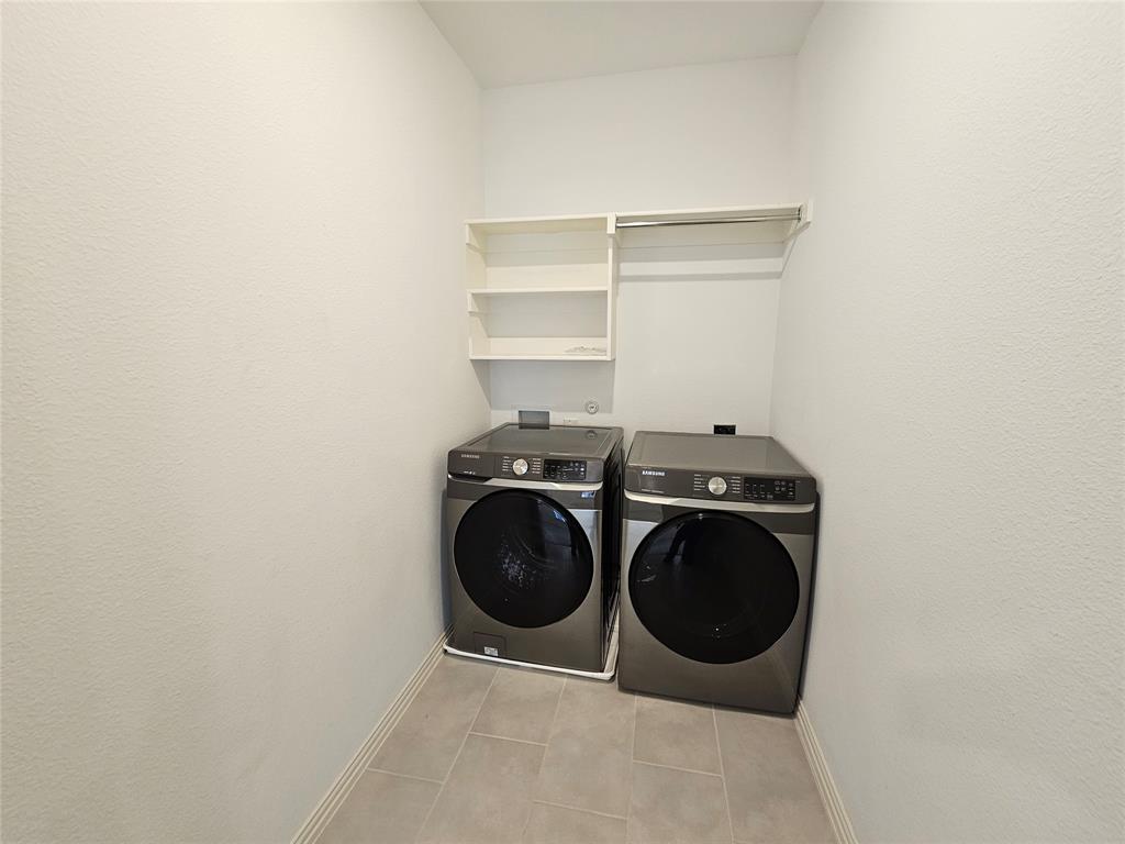 7280 Panicum Drive Frisco, TX 75033 - Photo 17 of 36 a utility room with dryer and washer