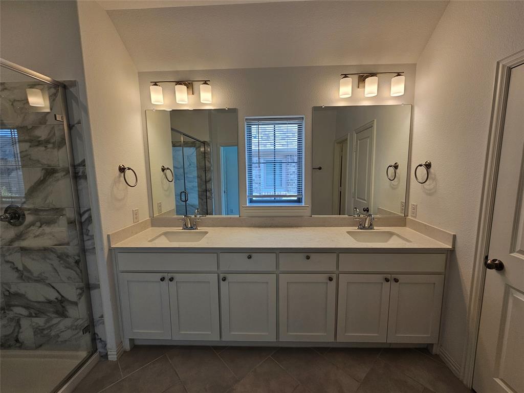 7280 Panicum Drive Frisco, TX 75033 - Photo 21 of 36 a spacious bathroom with double sink and a mirror
