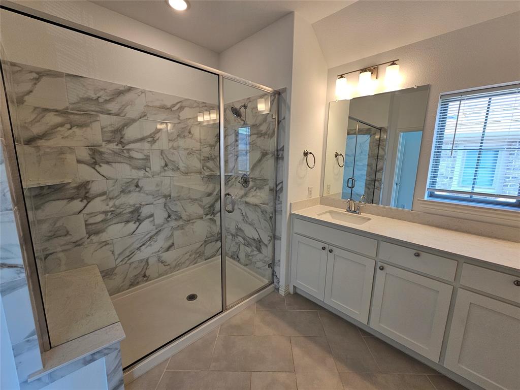 7280 Panicum Drive Frisco, TX 75033 - Photo 22 of 36 a bathroom with a shower and a sink