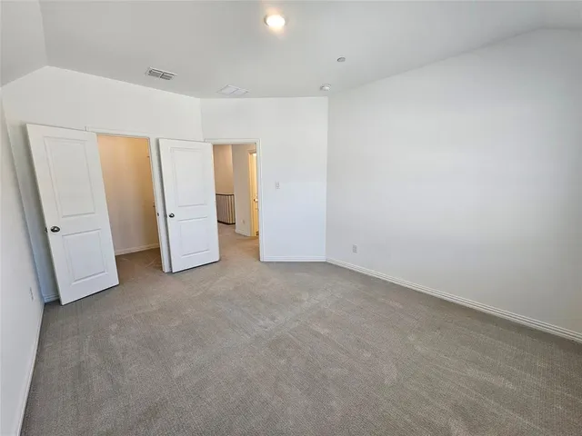 an aerial view of a house with garden space and street view