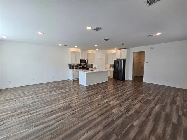 a view of kitchen with cabinets and stainless steel appliances