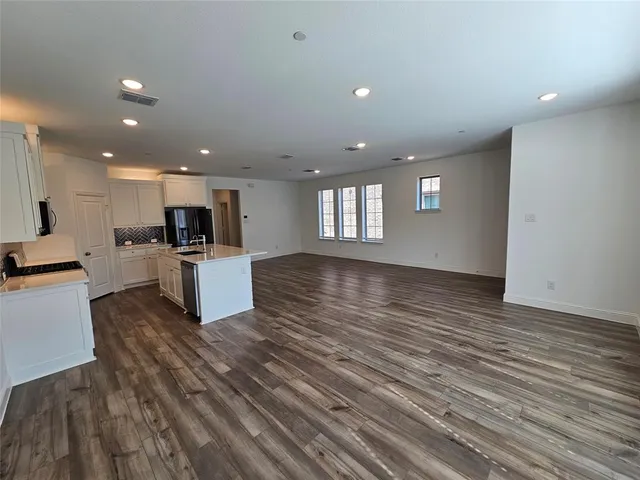 a kitchen with a stove and a microwave