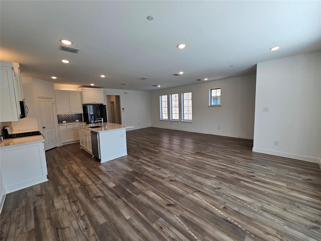 7280 Panicum Drive Frisco, TX 75033 - Photo 7 of 36 a view of kitchen with cabinets and stainless steel appliances