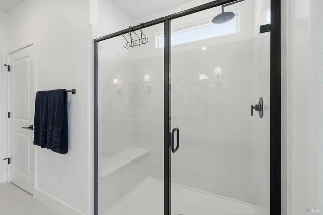 an aerial view of a house with a garden and swimming pool