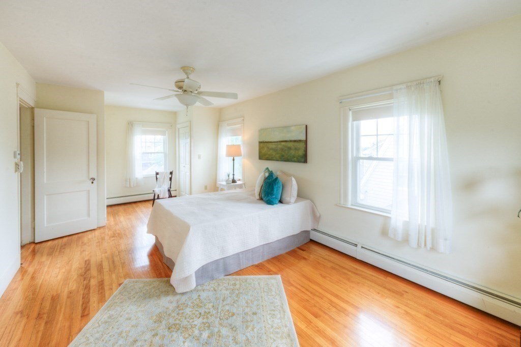 5 Bellingham Road Worcester, MA 01606 - Photo 16 of 30 a bed room with a bed and a chandelier