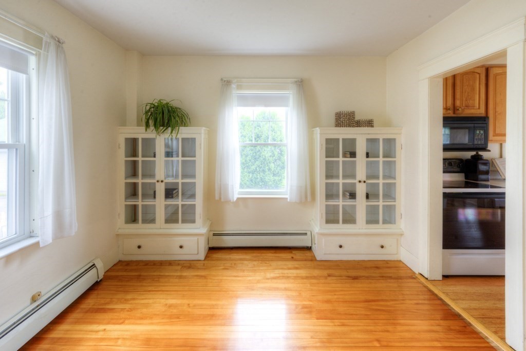 5 Bellingham Road Worcester, MA 01606 - Photo 5 of 30 a view of an empty room with a window and kitchen view
