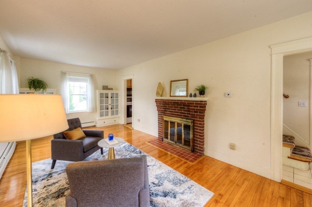 5 Bellingham Road Worcester, MA 01606 - Photo 6 of 30 a living room with furniture and a fireplace