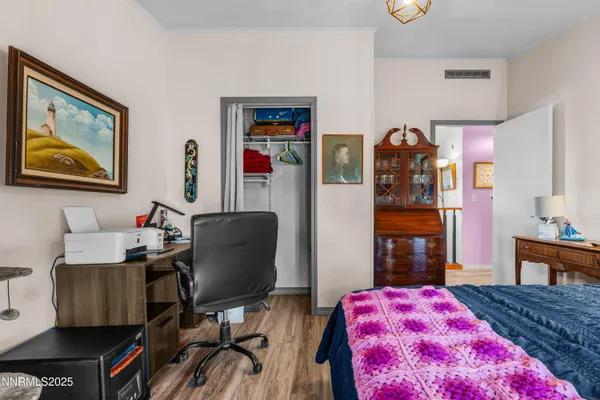 a bedroom with a bed and a table in it