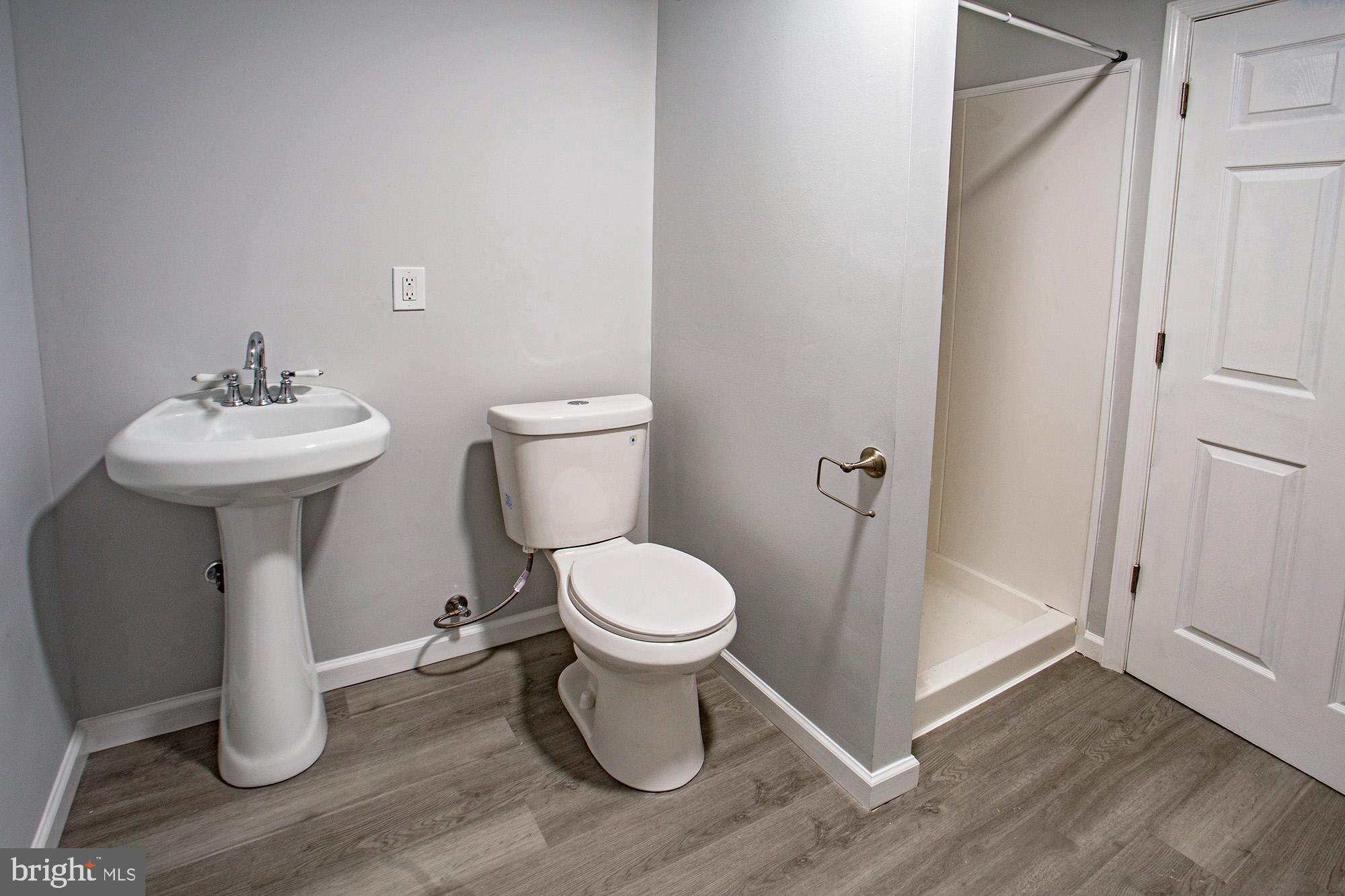 653 Gordon House Way Middletown, DE 19709 - Photo 5 of 7 a white toilet sitting next to a bathroom sink