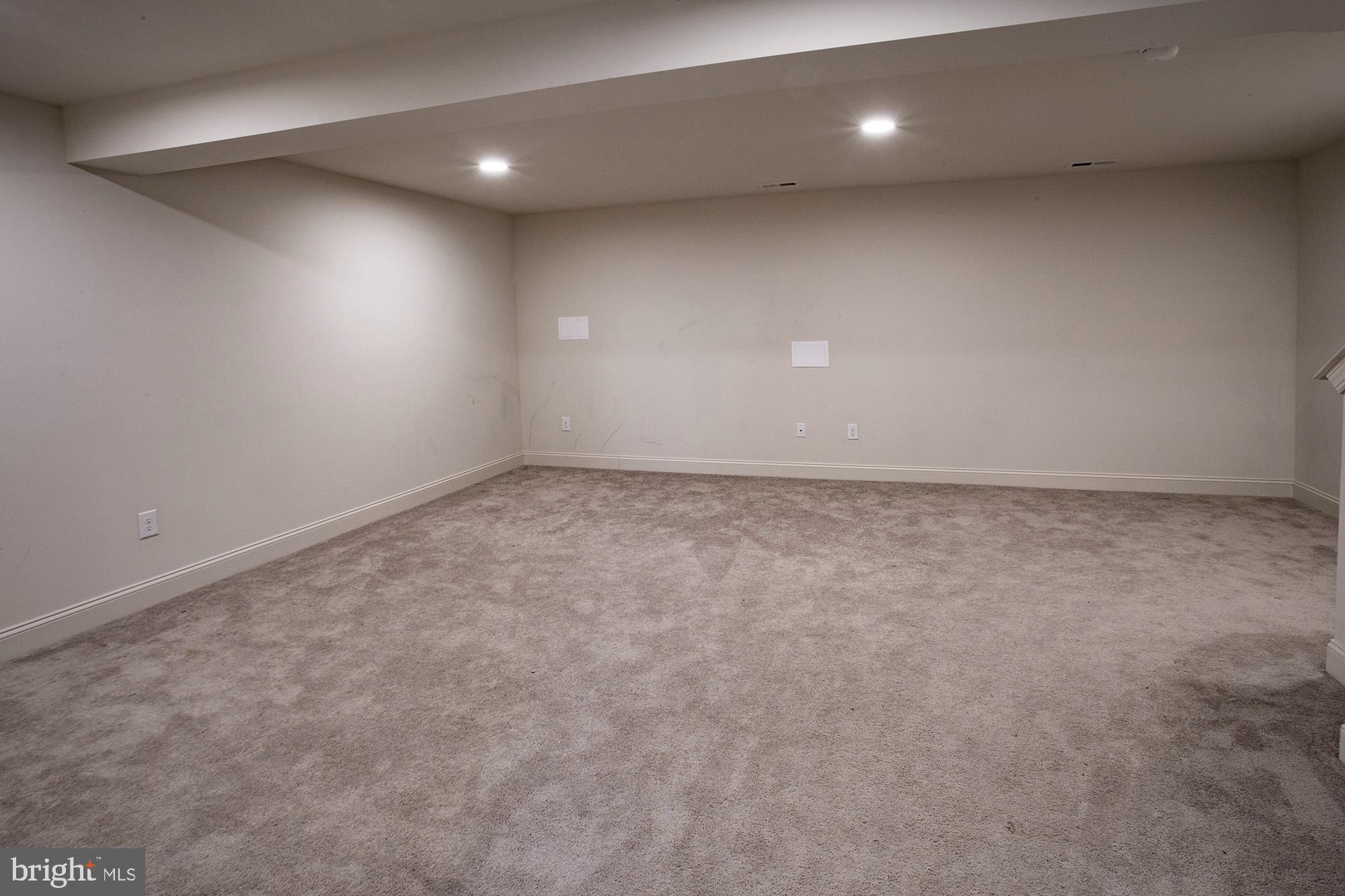 653 Gordon House Way Middletown, DE 19709 - Photo 7 of 7 an empty room with a hard wood floor