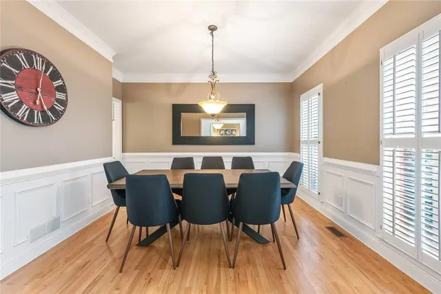 a view of a dining room with furniture window and wooden floor