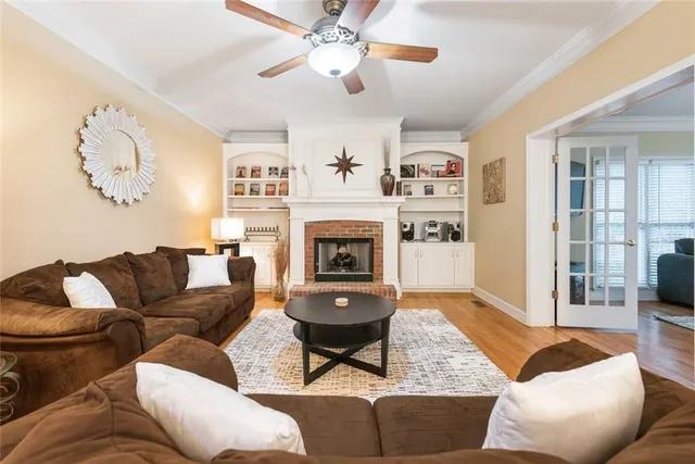 a living room with furniture and a fireplace