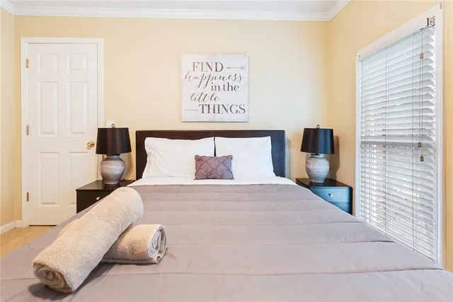 a large white bed in a white room