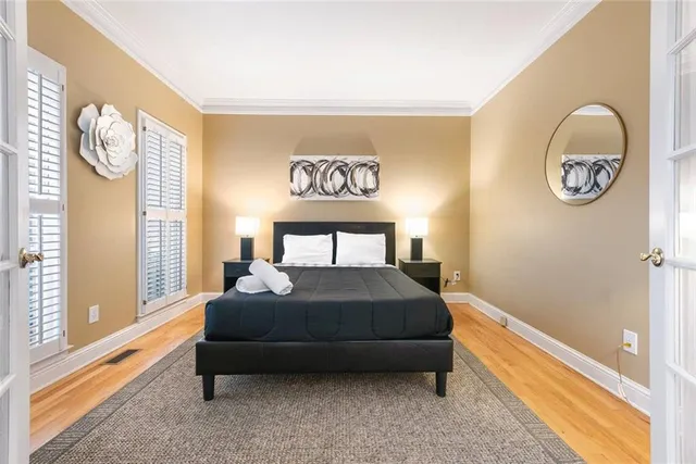 a bedroom with a bed and a window