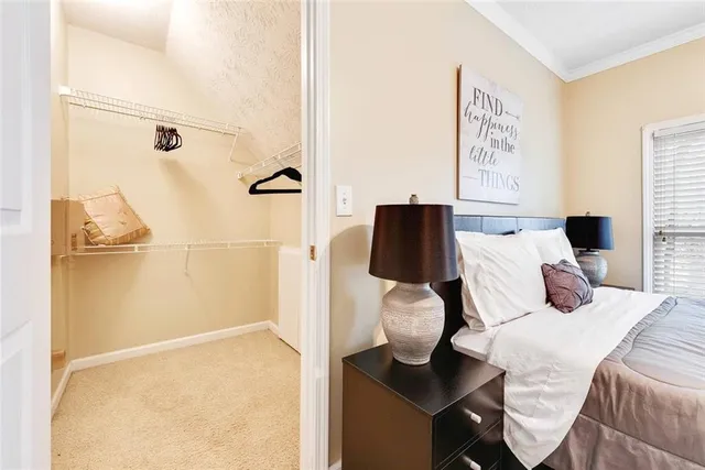 a bedroom with a bed and a cabinets