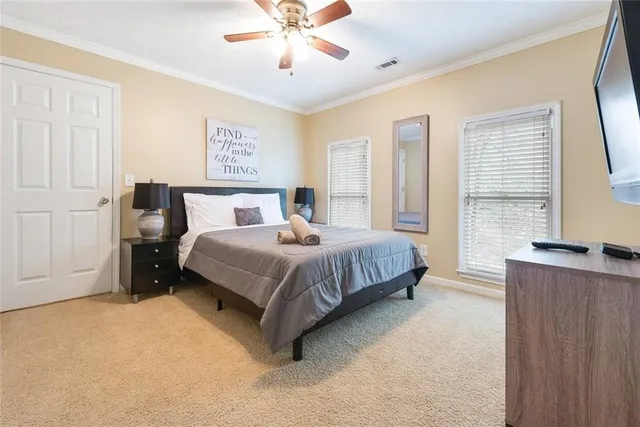 a bedroom with a bed and window
