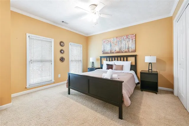 a bed room with a bed and a painting