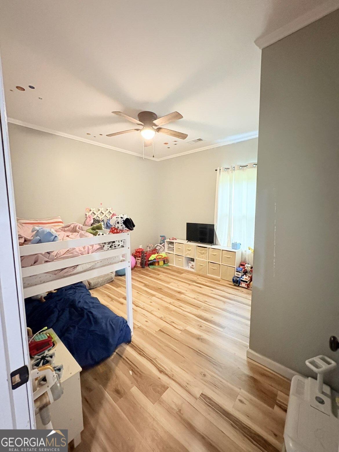 210 St Galilee Road Swainsboro, GA 30401 - Photo 14 of 18 a bedroom with a bed and a dresser in it