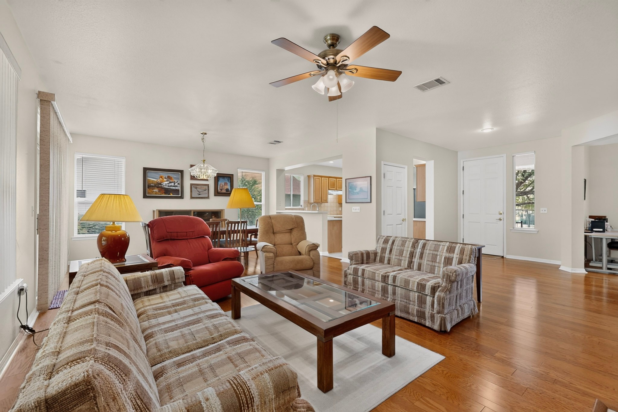 207 Red Poppy Trail Georgetown, TX 78633 - Photo 6 of 31 Hardwood floors and generous natural light create an inviting atmosphere throughout this versatile living space.