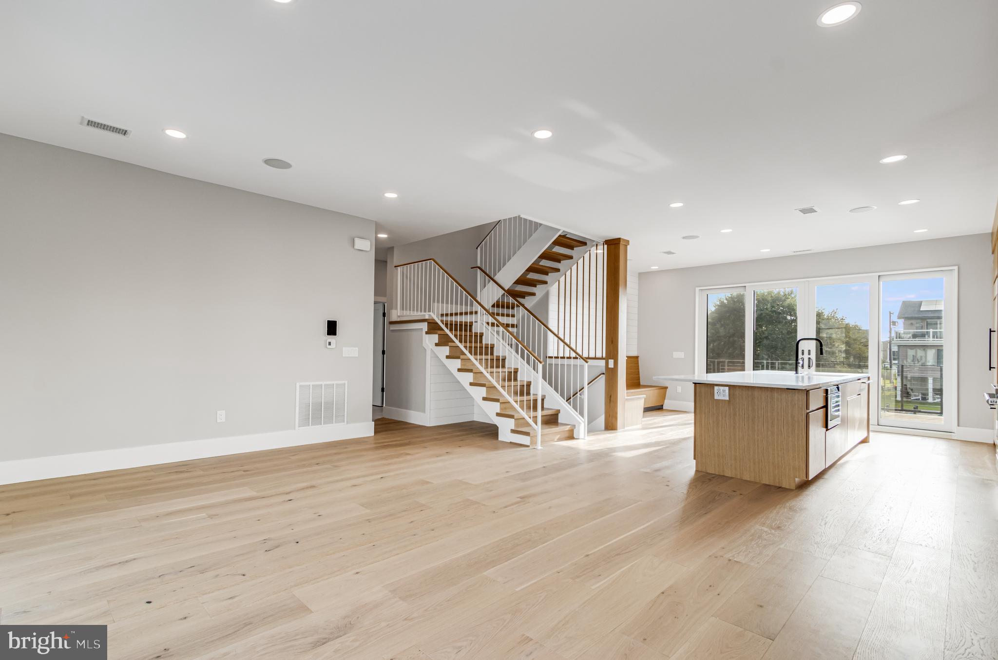 316 York Road Bethany Beach, DE 19930 - Photo 24 of 104 an empty room with wooden floor and windows