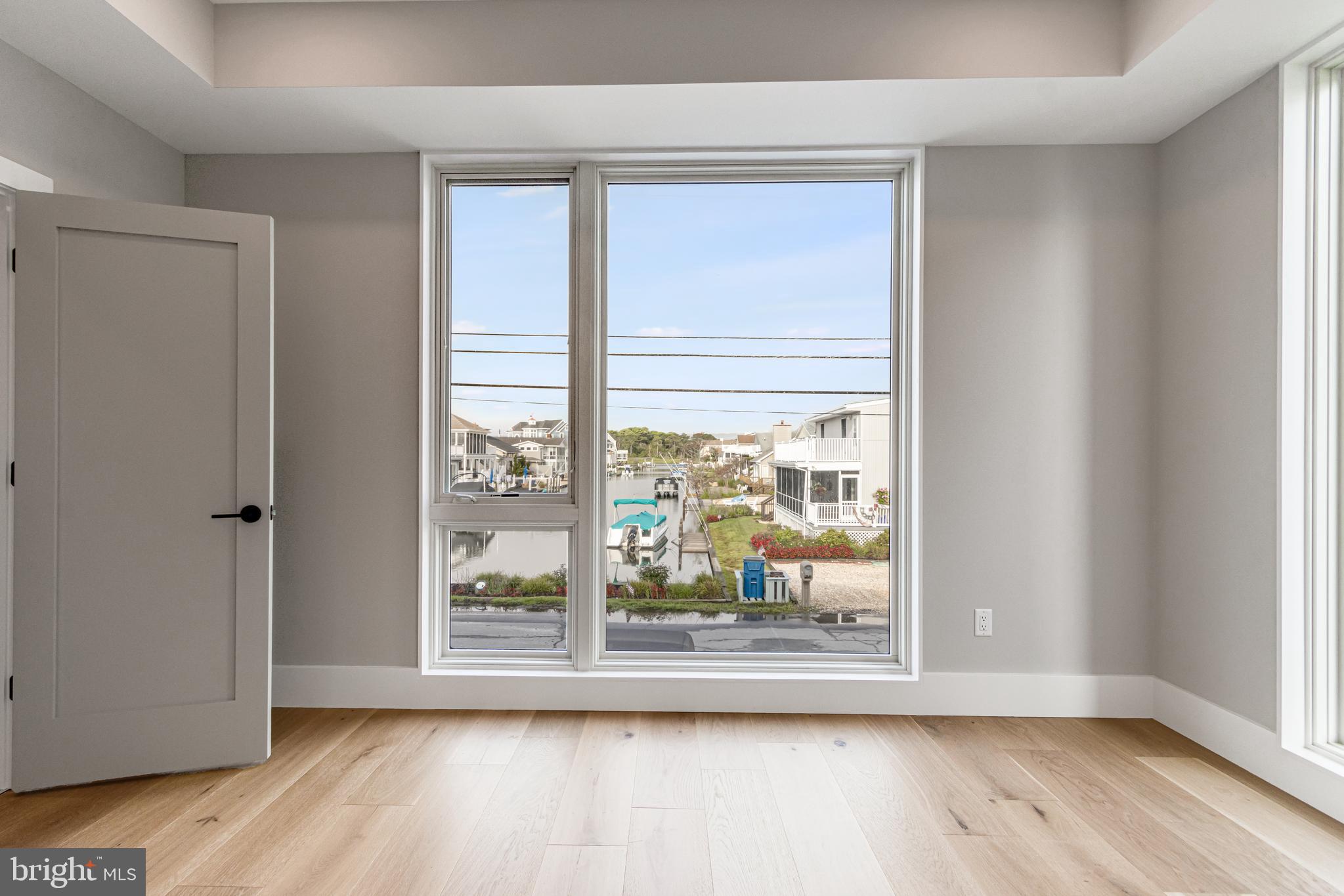 316 York Road Bethany Beach, DE 19930 - Photo 28 of 104 a view of empty room with wooden floor and fan