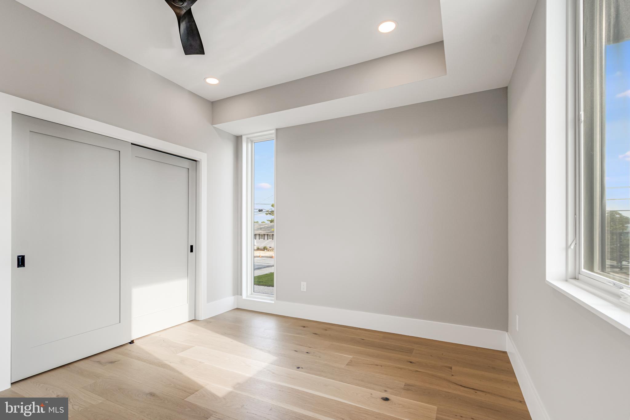 316 York Road Bethany Beach, DE 19930 - Photo 32 of 104 wooden floor in an empty room with a window