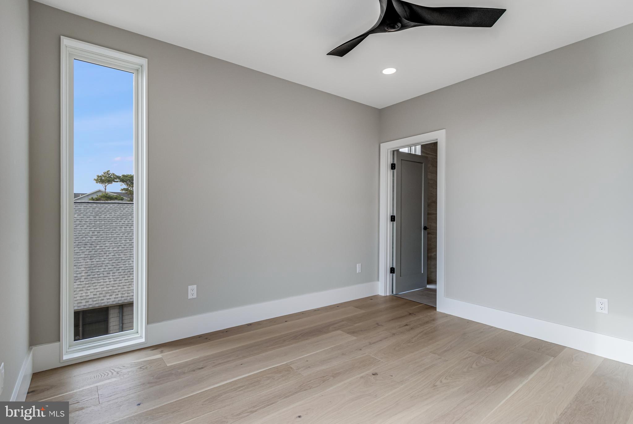 316 York Road Bethany Beach, DE 19930 - Photo 41 of 104 wooden floor in an empty room
