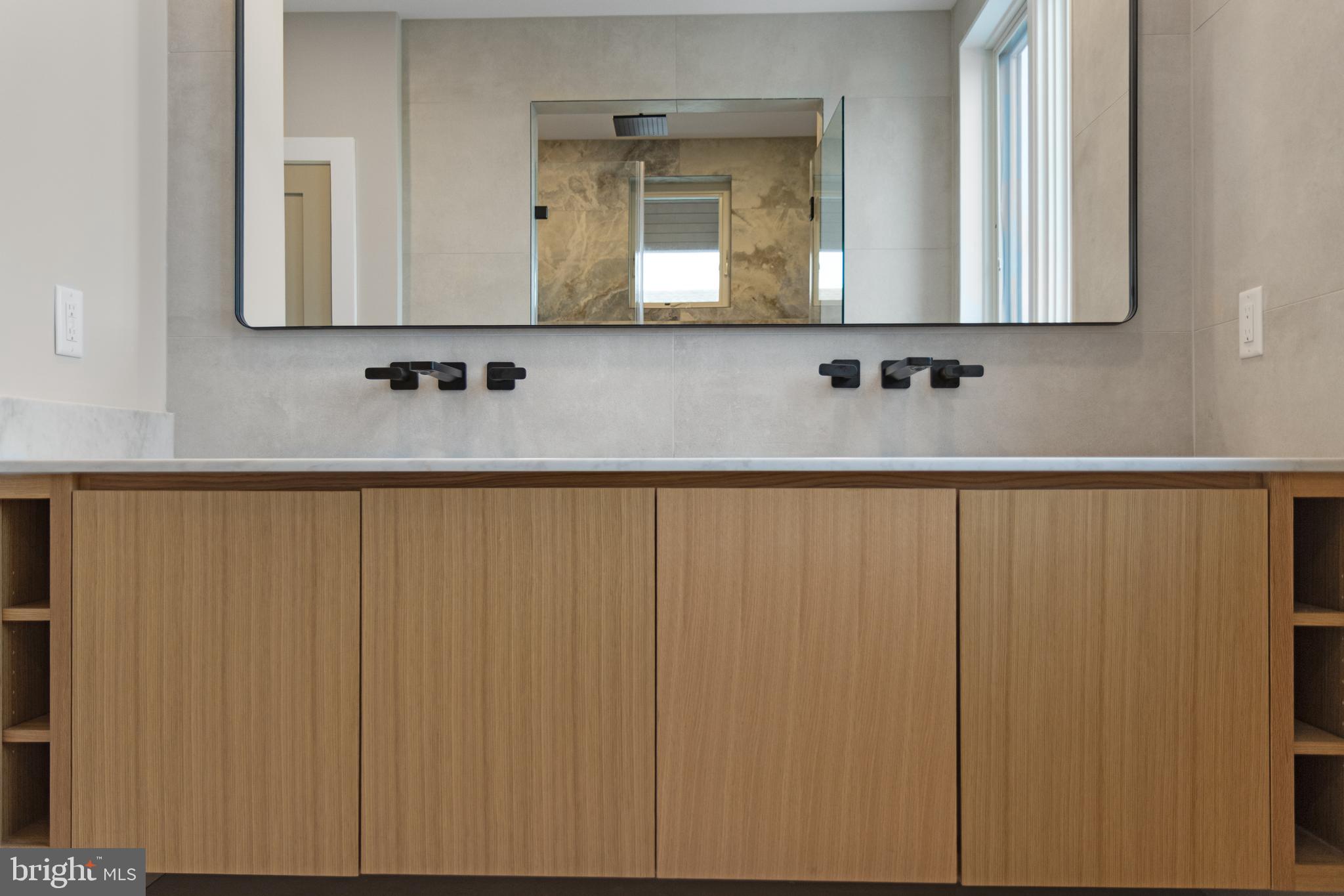316 York Road Bethany Beach, DE 19930 - Photo 58 of 104 a bathroom with a sink and a mirror