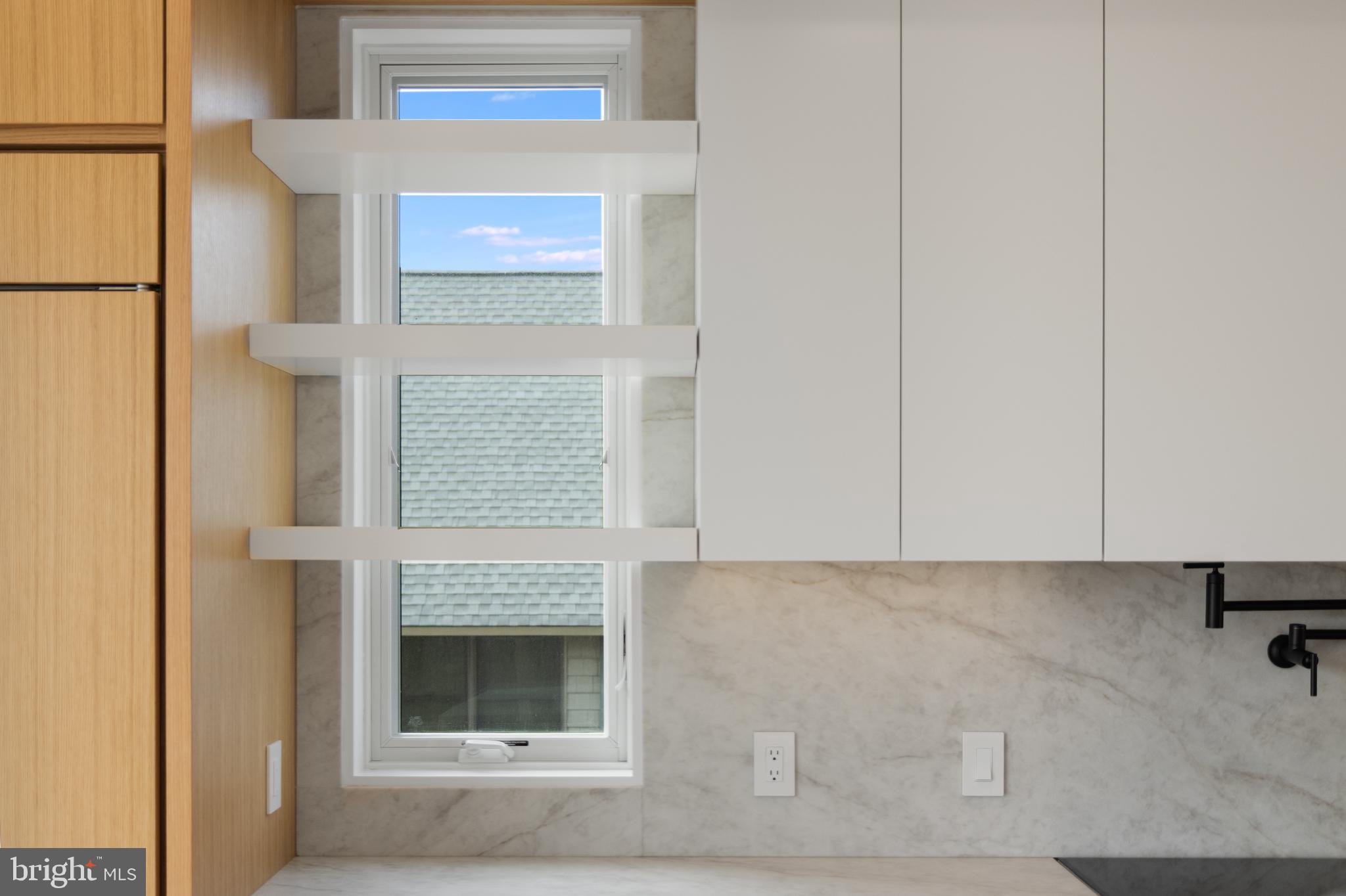 316 York Road Bethany Beach, DE 19930 - Photo 6 of 104 a living room with a fireplace and a rug