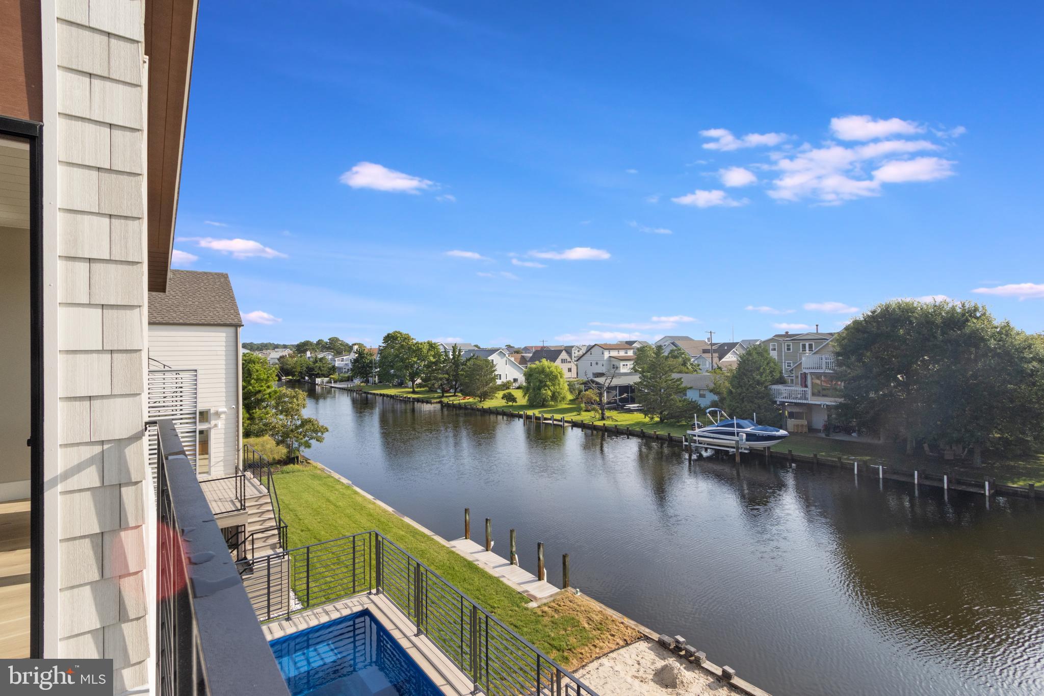 316 York Road Bethany Beach, DE 19930 - Photo 80 of 104 a view of a lake with a city from a lake