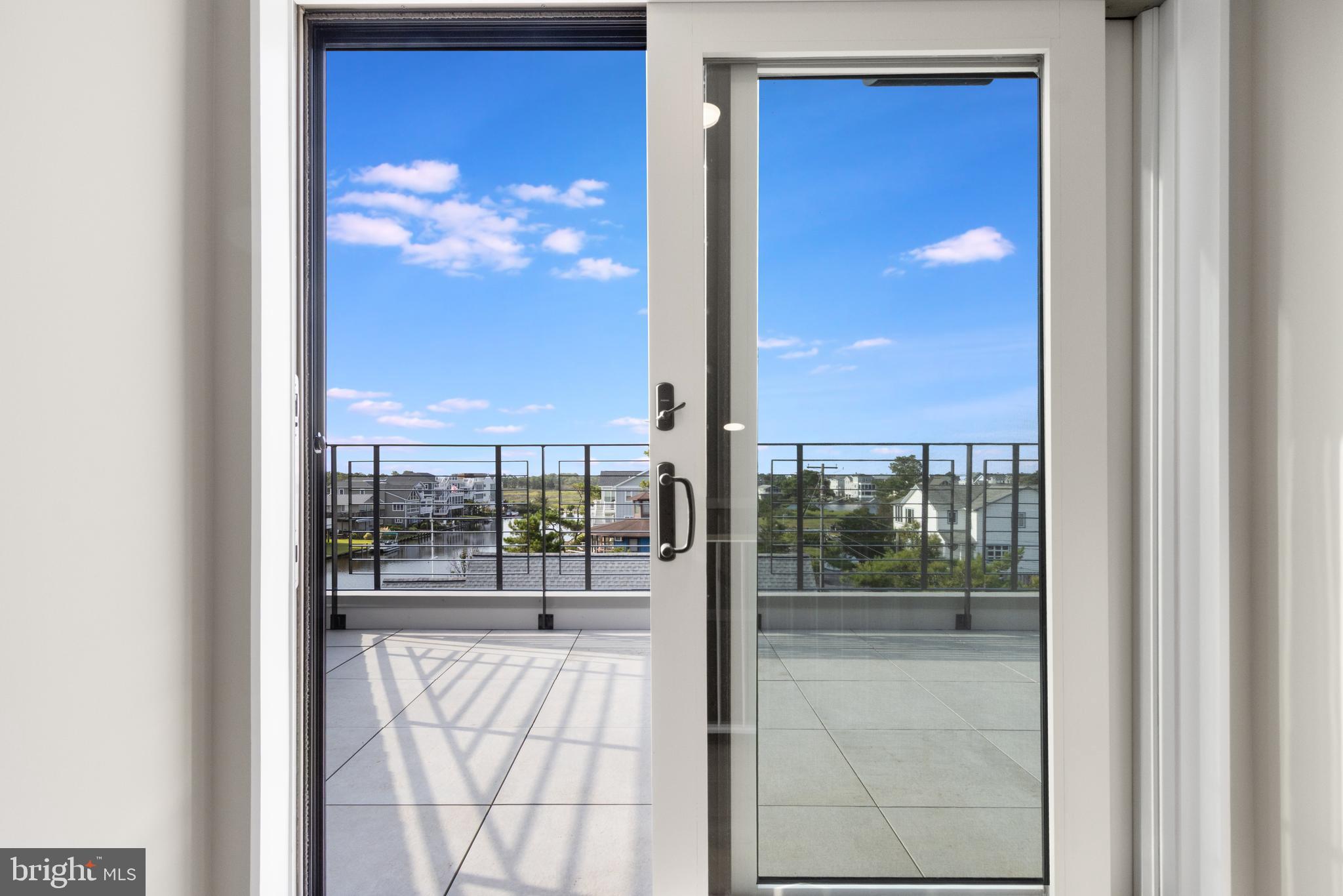 316 York Road Bethany Beach, DE 19930 - Photo 83 of 104 a view of a glass door with a living room