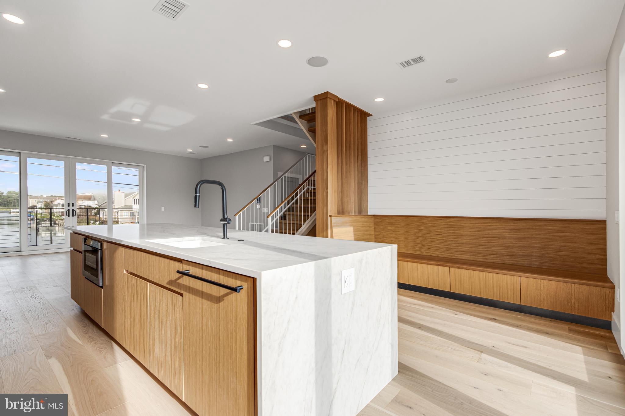 316 York Road Bethany Beach, DE 19930 - Photo 10 of 104 a kitchen with a sink and a refrigerator