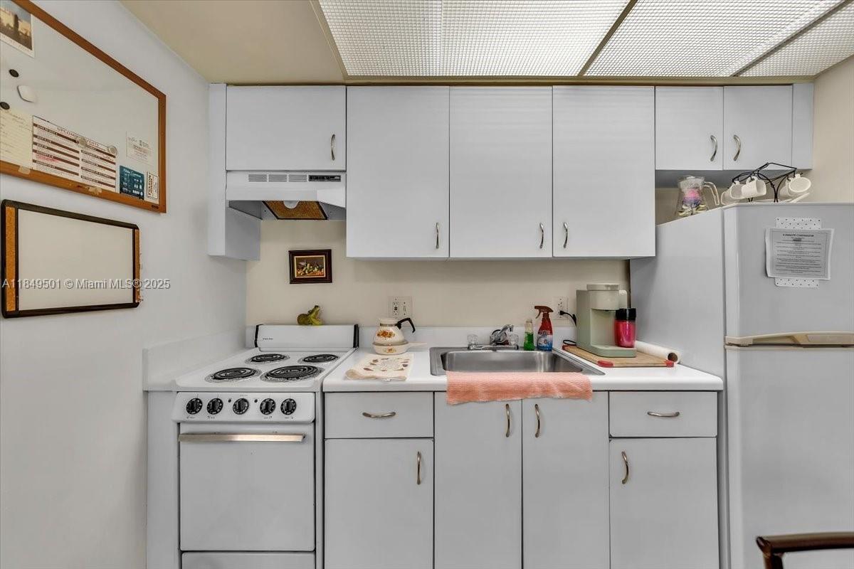 13455 Southwest 16th Court, Unit 104F Pembroke Pines, FL 33027 - Photo 12 of 53 a room with storage and utility