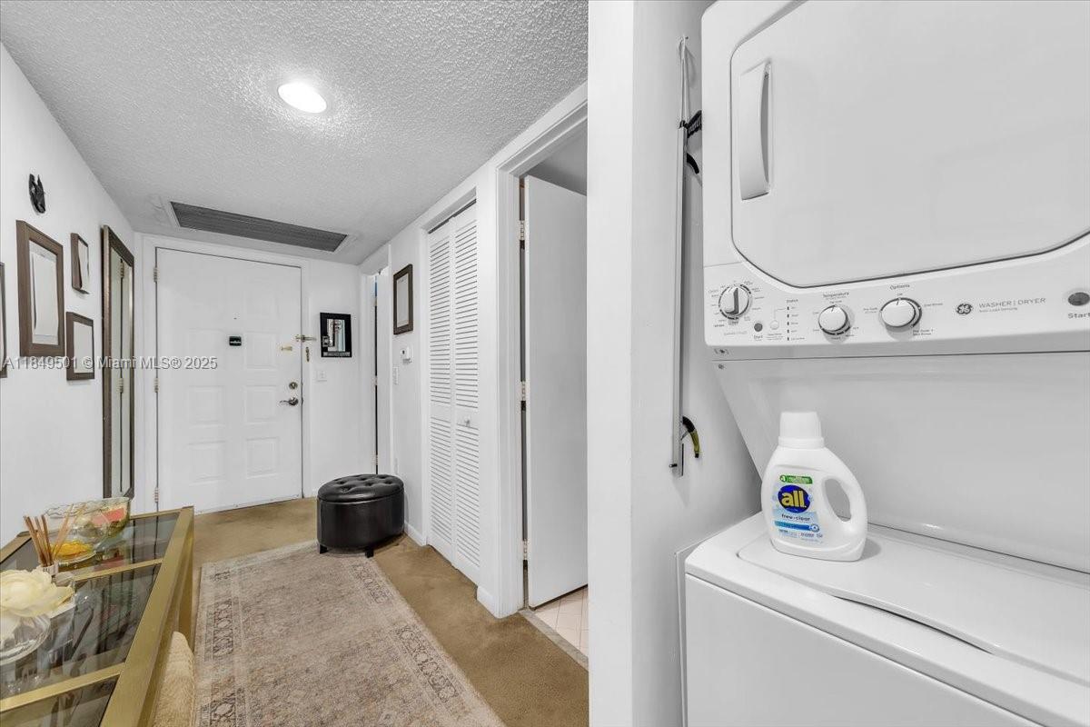 13455 Southwest 16th Court, Unit 104F Pembroke Pines, FL 33027 - Photo 16 of 53 a bedroom with a bed and a mirror