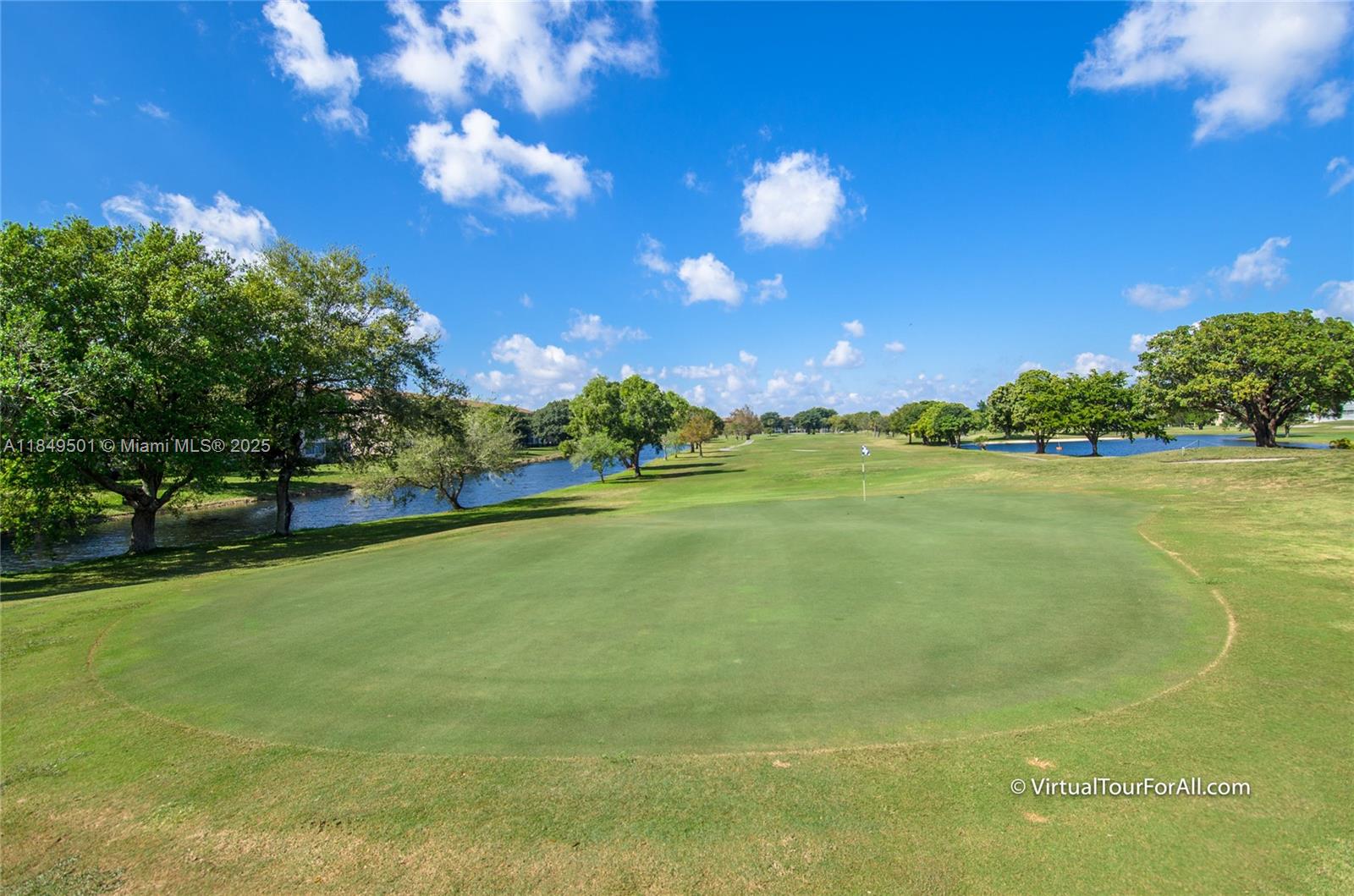 13455 Southwest 16th Court, Unit 104F Pembroke Pines, FL 33027 - Photo 48 of 53 a view of a golf course with a lake